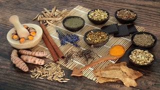 List of adaptogens. Various herbs in small bowls, mortar and pestle.