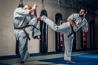 Nootropics for Martial Arts man in gi kicking another man who is blocking while wearing a gi