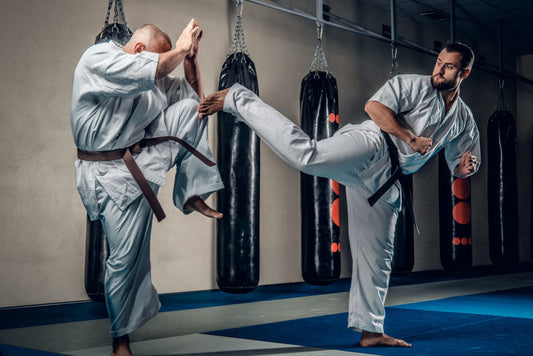 Nootropics for Martial Arts man in gi kicking another man who is blocking while wearing a gi