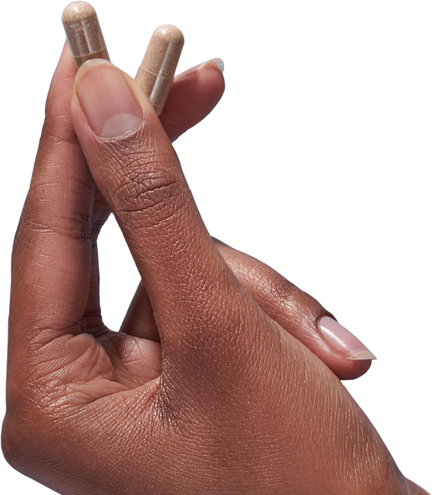 image of a hand holding two Mind Lab Pro® capsules